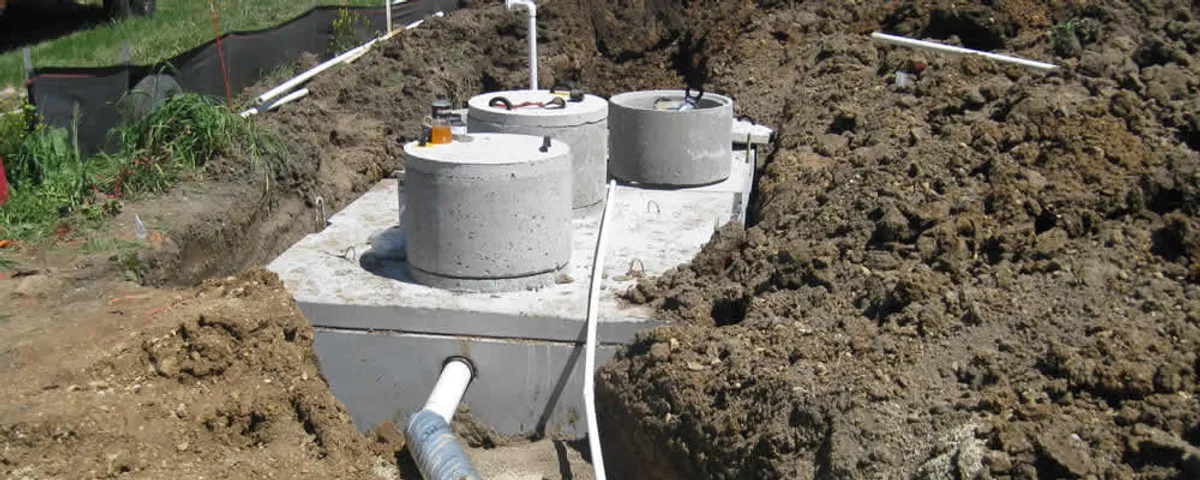 Septic system repair and installation site with tank access ports in Albuquerque, NM